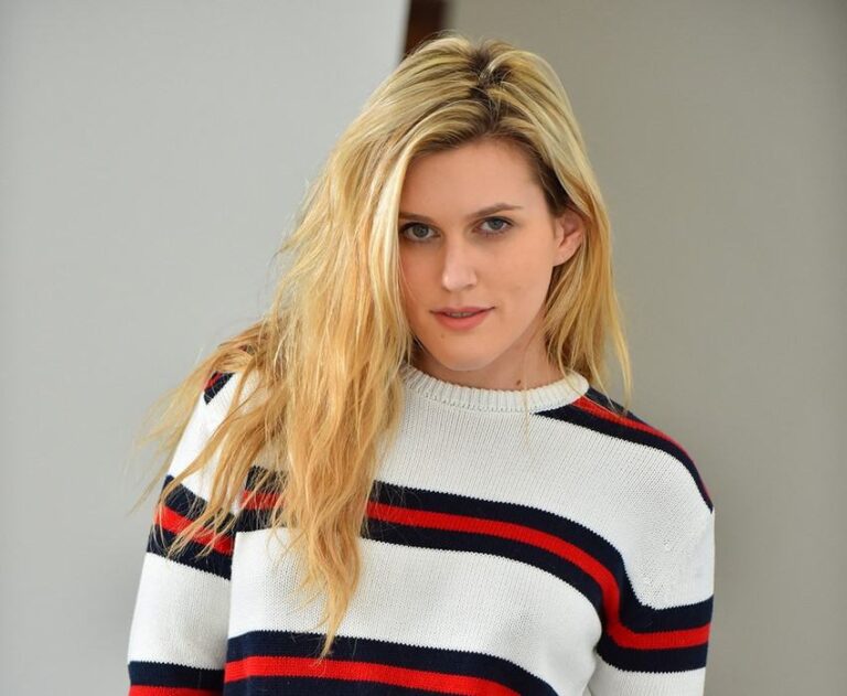 Sasha Heart in a striped white sweater